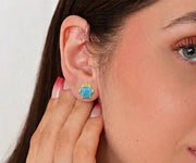 Blue topaz earrings featuring sparkling sky-blue gemstones set in elegant minimalist studs perfect for everyday wear or special occasions